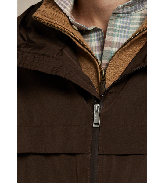 Crafted from water-repellent fabric, this jacket features functional details, such as a mesh-lined vented back and metal grommets on the underarms for breathability.