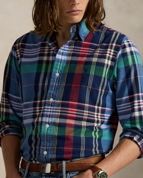 The oxford shirt made its debut very early in Ralph Lauren Lauren’s designs, and since then, it has solidified its status as a pillar of the Polo look. Our fabric is developed with a secret wash, giving it instant character, ease and a heathered softness – what we refer to as "the perfect rumple". The formula is so unique that it's been kept in a safe for more than three decades. Today, Mr Lauren continues to create countless variations of his iconic shirt, including this plaid version, which is finished with our signature embroidered Pony.