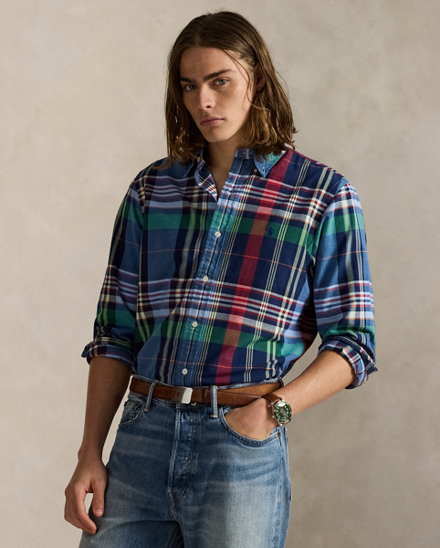 The oxford shirt made its debut very early in Ralph Lauren Lauren’s designs, and since then, it has solidified its status as a pillar of the Polo look. Our fabric is developed with a secret wash, giving it instant character, ease and a heathered softness – what we refer to as "the perfect rumple". The formula is so unique that it's been kept in a safe for more than three decades. Today, Mr Lauren continues to create countless variations of his iconic shirt, including this plaid version, which is finished with our signature embroidered Pony.