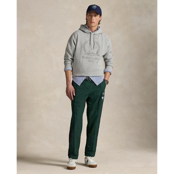 Part of our collection celebrating Wimbledon 2025, these unisex trousers feature a "Polo Ralph Lauren Lauren" patch, the tournament's logo and tennis-inspired embroidery. They are crafted from water-repellent ripstop and fully lined with breathable mesh for optimal ventilation.