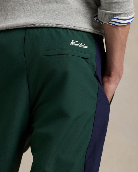 Part of our collection celebrating Wimbledon 2025, these unisex trousers feature a "Polo Ralph Lauren Lauren" patch, the tournament's logo and tennis-inspired embroidery. They are crafted from water-repellent ripstop and fully lined with breathable mesh for optimal ventilation.