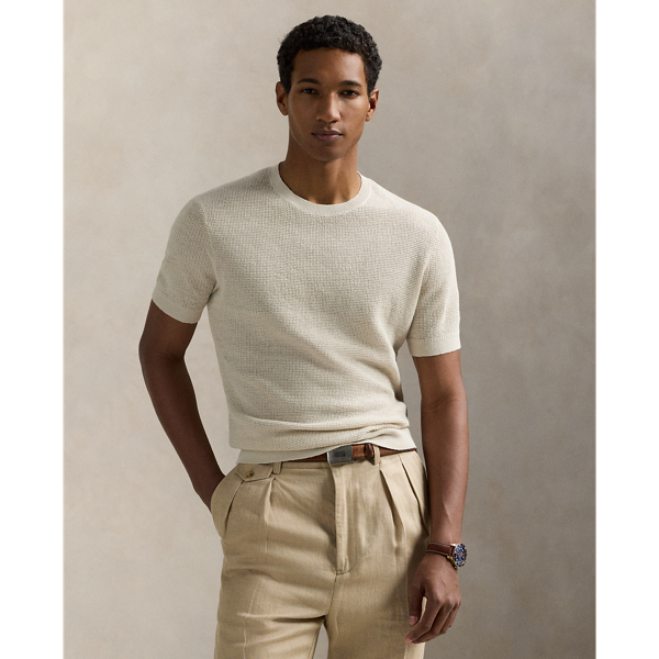 A stylish solution for warm-weather days, this short-sleeve jumper is developed with lightweight linen yarn and an airy tuck-stitch construction.