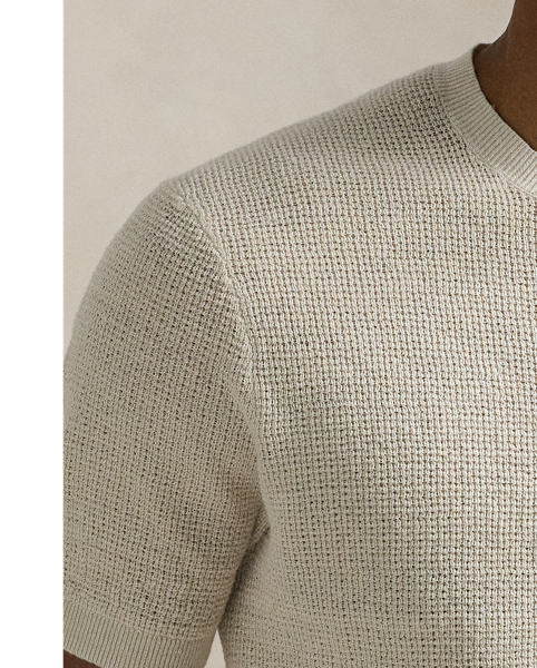 A stylish solution for warm-weather days, this short-sleeve jumper is developed with lightweight linen yarn and an airy tuck-stitch construction.