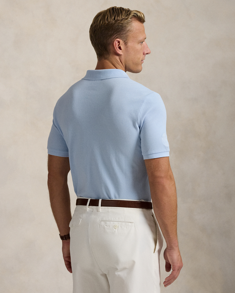 Part of our collection celebrating Wimbledon 2025, this unisex cotton Polo shirt is embroidered with our signature Pony and the official "The Championships Wimbledon" logo. It is dyed and washed to achieve distinct tonal nuances that provide a unique character to the cloth.