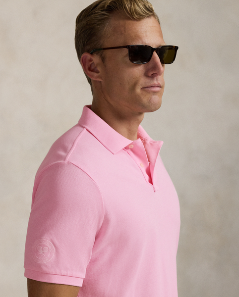 Part of our collection celebrating Wimbledon 2025, this unisex cotton Polo shirt is embroidered with our signature Pony and the official "The Championships Wimbledon" logo. It is dyed and washed to achieve distinct tonal nuances that provide a unique character to the cloth.