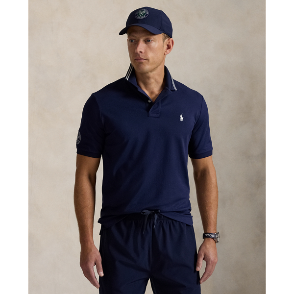 Part of our collection celebrating Wimbledon 2025, this Polo shirt features the tournament's official logo and our signature embroidered Pony. It is made from a comfortable stretch mesh fabric, which is developed with moisture-wicking properties.