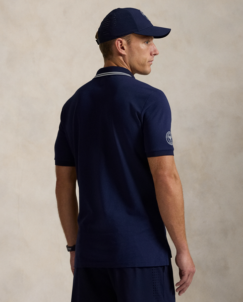 Part of our collection celebrating Wimbledon 2025, this Polo shirt features the tournament's official logo and our signature embroidered Pony. It is made from a comfortable stretch mesh fabric, which is developed with moisture-wicking properties.