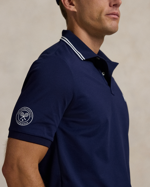 Part of our collection celebrating Wimbledon 2025, this Polo shirt features the tournament's official logo and our signature embroidered Pony. It is made from a comfortable stretch mesh fabric, which is developed with moisture-wicking properties.