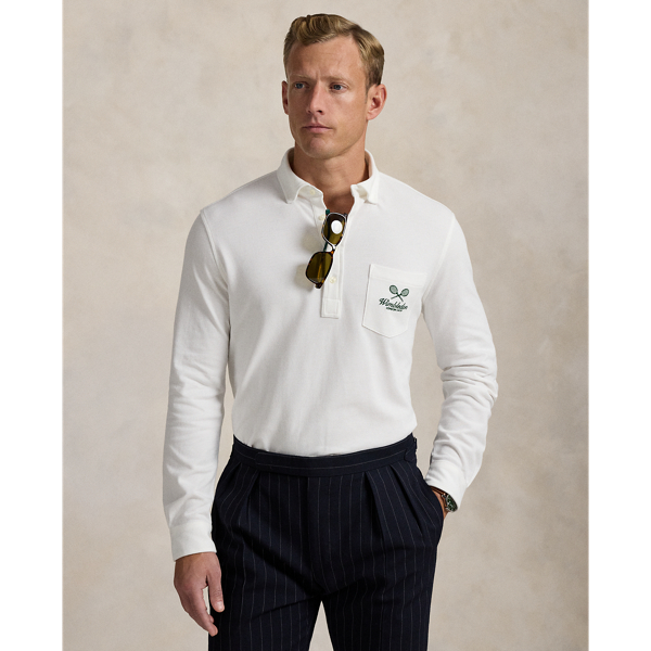 Part of our collection celebrating Wimbledon 2025, this unisex Polo shirt is embroidered with the tournament's logo and location, which includes its "SW19" postcode. Our signature embroidered Pony and genuine mother-of-pearl buttons adorn this cotton mesh style.