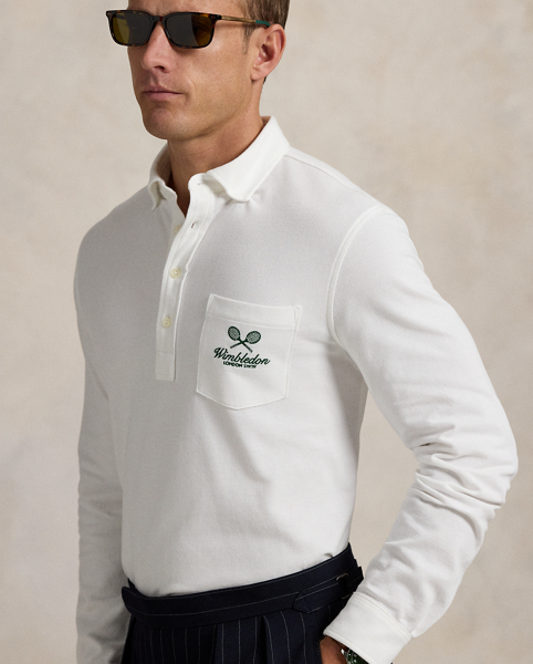 Part of our collection celebrating Wimbledon 2025, this unisex Polo shirt is embroidered with the tournament's logo and location, which includes its "SW19" postcode. Our signature embroidered Pony and genuine mother-of-pearl buttons adorn this cotton mesh style.