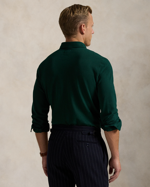 Part of our collection celebrating Wimbledon 2025, this unisex Polo shirt is embroidered with the tournament's logo and location, which includes its "SW19" postcode. Our signature embroidered Pony and genuine mother-of-pearl buttons adorn this cotton mesh style.