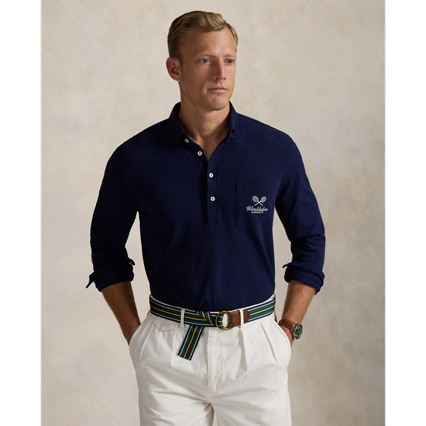 Part of our collection celebrating Wimbledon 2025, this unisex Polo shirt is embroidered with the tournament's logo and location, which includes its "SW19" postcode. Our signature embroidered Pony and genuine mother-of-pearl buttons adorn this cotton mesh style.