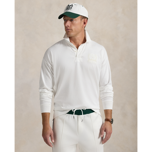 Part of our collection celebrating Wimbledon 2025, this unisex jersey rugby shirt features a signature tennis-inspired crest that commemorates this year's tournament.