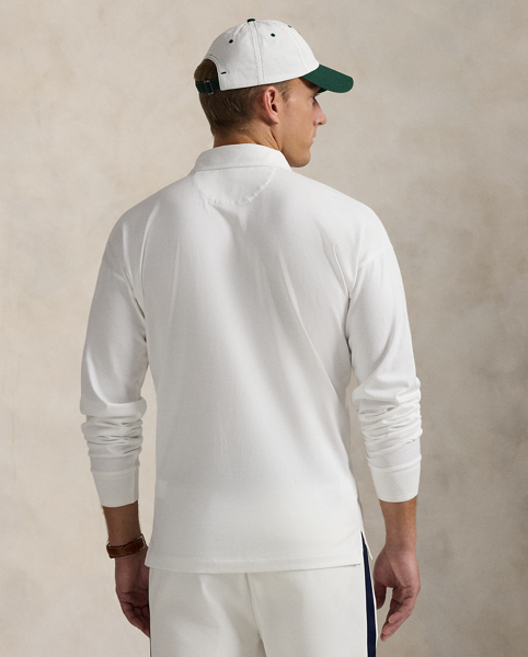 Part of our collection celebrating Wimbledon 2025, this unisex jersey rugby shirt features a signature tennis-inspired crest that commemorates this year's tournament.