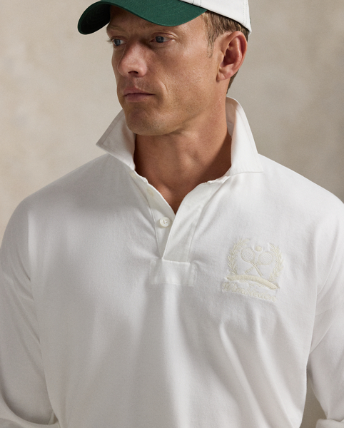 Part of our collection celebrating Wimbledon 2025, this unisex jersey rugby shirt features a signature tennis-inspired crest that commemorates this year's tournament.