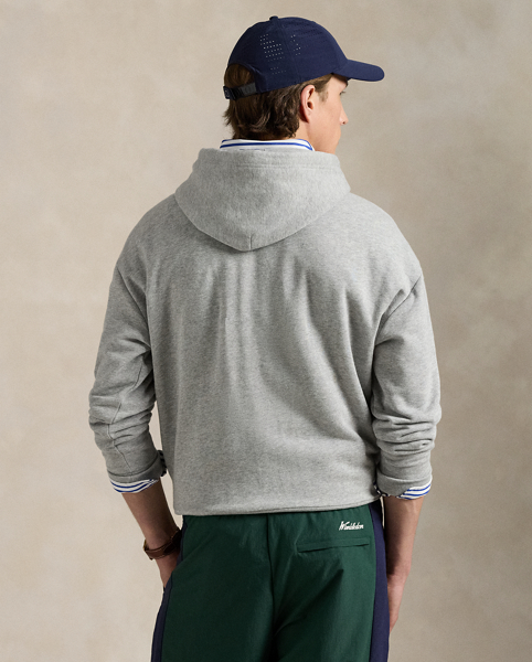 Part of our collection celebrating Wimbledon 2025, this unisex cotton-blend hoodie features a tennis-inspired "Polo Ralph Lauren Lauren" crest and the tournament's logo intricately embroidered on the front.
