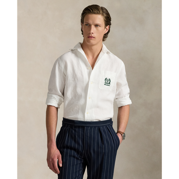 Part of our collection celebrating Wimbledon 2025, this unisex linen shirt features a tennis-inspired "Polo Ralph Lauren Lauren" crest and the tournament's logo intricately embroidered on the chest pocket.
