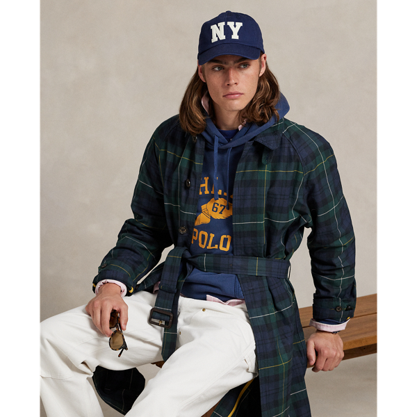 This balmacaan coat showcases heritage-inspired elegance with a classic plaid pattern inspired by traditional Scottish motifs. Expertly crafted from waxed cotton twill, it reflects Ralph Lauren Lauren's dedication to creating garments that stand the test of time.