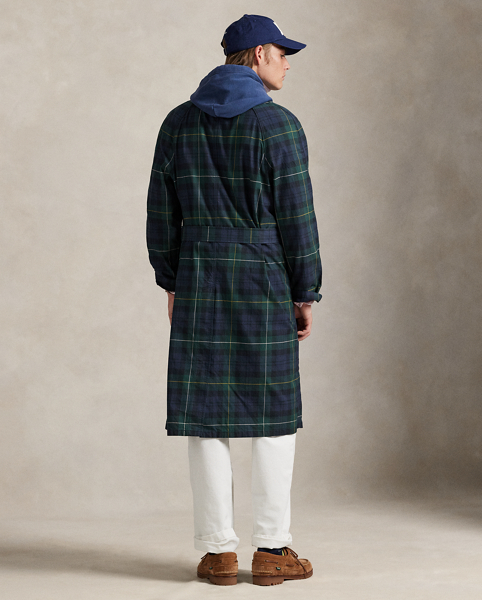 This balmacaan coat showcases heritage-inspired elegance with a classic plaid pattern inspired by traditional Scottish motifs. Expertly crafted from waxed cotton twill, it reflects Ralph Lauren Lauren's dedication to creating garments that stand the test of time.