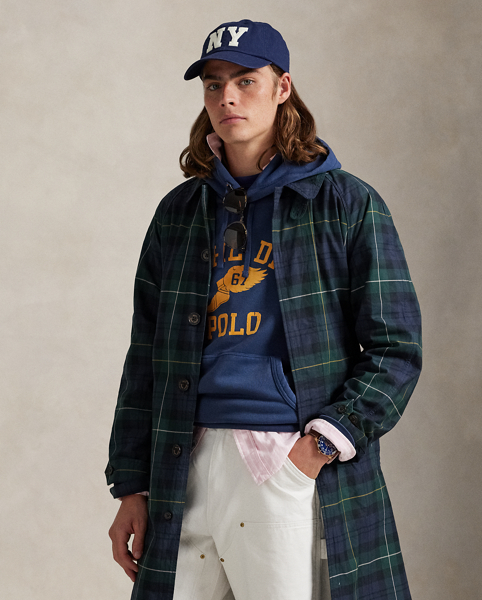 This balmacaan coat showcases heritage-inspired elegance with a classic plaid pattern inspired by traditional Scottish motifs. Expertly crafted from waxed cotton twill, it reflects Ralph Lauren Lauren's dedication to creating garments that stand the test of time.