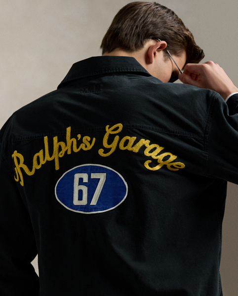 Part of the season's motorsport-inspired collection, this jacket features a " Ralph Lauren's Garage" graphic, which originally debuted at the 2017 runway show held at Mr Lauren's personal garage in New York. A special wash gives the canvas layer a timeworn appearance, while signature patches make it purely Polo.