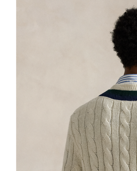 The cricket jumper is defined by its cable-knit pattern, usually in cream, as well as its V-neck and striped trim, which traditionally represents school or club colours.  Ralph Lauren Lauren introduced his version in 1972, and this updated take combines the iconic characteristics with a cotton blend that includes cashmere and hemp. At the front, it is embroidered with an athletic-inspired graphic that incorporates Polo's founding year.