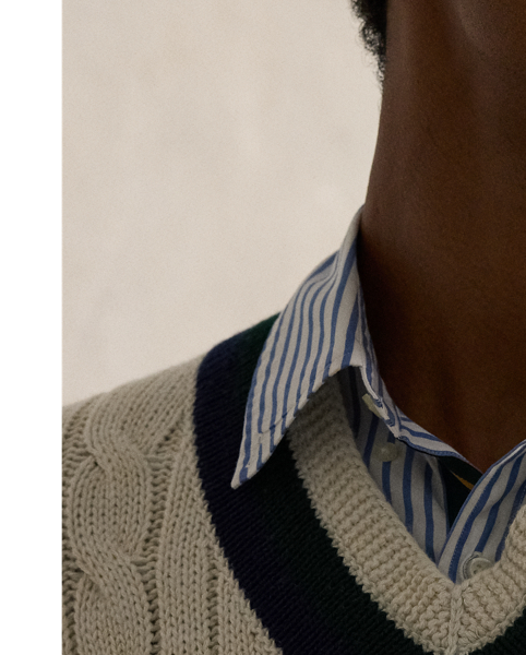 The cricket jumper is defined by its cable-knit pattern, usually in cream, as well as its V-neck and striped trim, which traditionally represents school or club colours.  Ralph Lauren Lauren introduced his version in 1972, and this updated take combines the iconic characteristics with a cotton blend that includes cashmere and hemp. At the front, it is embroidered with an athletic-inspired graphic that incorporates Polo's founding year.