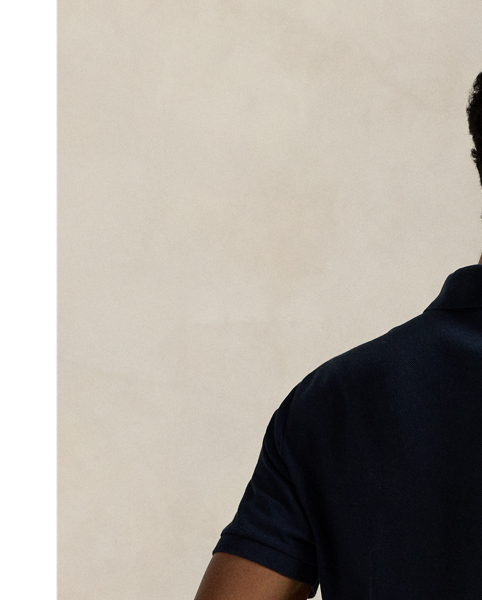 An American style standard since 1972, the Polo shirt has been imitated but never matched. Over the decades,  Ralph Lauren Lauren has reimagined his signature style in a wide array of colours and fits, yet all retain the quality and attention to detail of the iconic original. This version is made with honeycomb-textured cotton mesh and finished with genuine mother-of-pearl buttons.