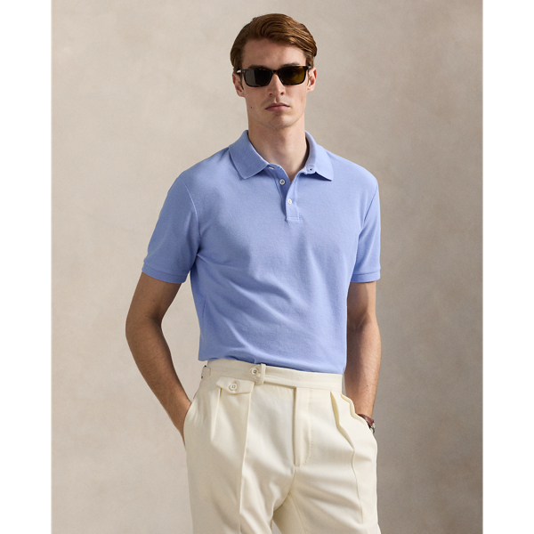 An American style standard since 1972, the Polo shirt has been imitated but never matched. Over the decades, Ralph Lauren Lauren has reimagined his signature style in a wide array of colours and fits, yet all retain the quality and attention to detail of the iconic original. This version is made with honeycomb-textured cotton mesh and finished with genuine mother-of-pearl buttons.