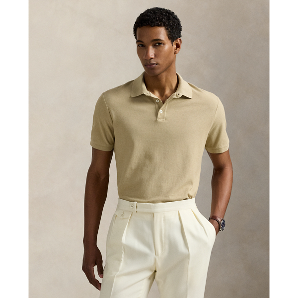 An American style standard since 1972, the Polo shirt has been imitated but never matched. Over the decades,  Ralph Lauren Lauren has reimagined his signature style in a wide array of colours and fits, yet all retain the quality and attention to detail of the iconic original. This version is made with honeycomb-textured cotton mesh and finished with genuine mother-of-pearl buttons.