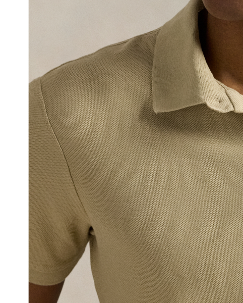 An American style standard since 1972, the Polo shirt has been imitated but never matched. Over the decades,  Ralph Lauren Lauren has reimagined his signature style in a wide array of colours and fits, yet all retain the quality and attention to detail of the iconic original. This version is made with honeycomb-textured cotton mesh and finished with genuine mother-of-pearl buttons.