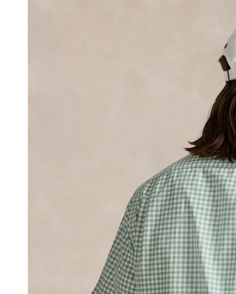 The oxford shirt made its debut very early in  Ralph Lauren Lauren’s designs, and since then, it has solidified its status as a pillar of the Polo look. Our fabric is developed with a secret wash, which gives it instant character, ease and a heathered softness – what we refer to as "the perfect rumple". The formula is so unique that it's been kept in a safe for more than three decades. Today, Mr Lauren continues to create countless variations of his iconic shirt, including this camp-collar version that features a classic gingham pattern.