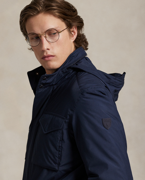 Perfect for travel and on-the-go lifestyles, this jacket packs into its own pocket and can attach to the handle of a suitcase once stored. Its bi-swing construction allows for ease of movement, while its water-repellent fabric and down-alternative fill help to protect you from the elements.