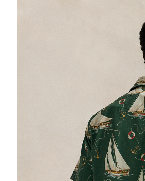 The oxford shirt made its debut very early in  Ralph Lauren Lauren’s designs, and since then, it has solidified its status as a pillar of the Polo look. Our fabric is developed with a secret wash, which gives it instant character, ease and a heathered softness – what we refer to as "the perfect rumple". The formula is so unique that it's been kept in a safe for more than three decades. Today, Mr Lauren continues to create countless variations of his iconic shirt, including this camp-collar version. It features an archival  Ralph Lauren Lauren print from the early aughts: a sailboat motif inspired by mid-20th-century home furnishing patterns.