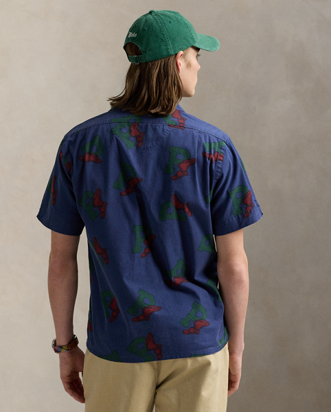 This lightweight cotton chino shirt features our iconic P-Wing logo, which was first introduced in 1992 and is inspired by vintage track-and-field iconography.