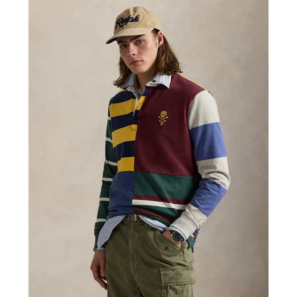 Designed with all the hallmarks of a traditional rugby shirt, this version features a pieced construction comprising bold stripes and solid-hued panels. It is intricately embroidered with our logo and a vintage collegiate-inspired emblem.