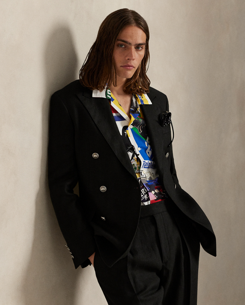 This camp shirt is printed with a collage of custom artwork that's based on vintage motorsport posters and the patches used in the season's racing-inspired collection.