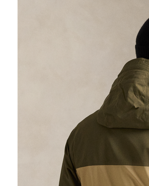 This colour-blocked jacket shields you from the rain thanks to its lightweight, water-resistant fabric and drawstring hood.