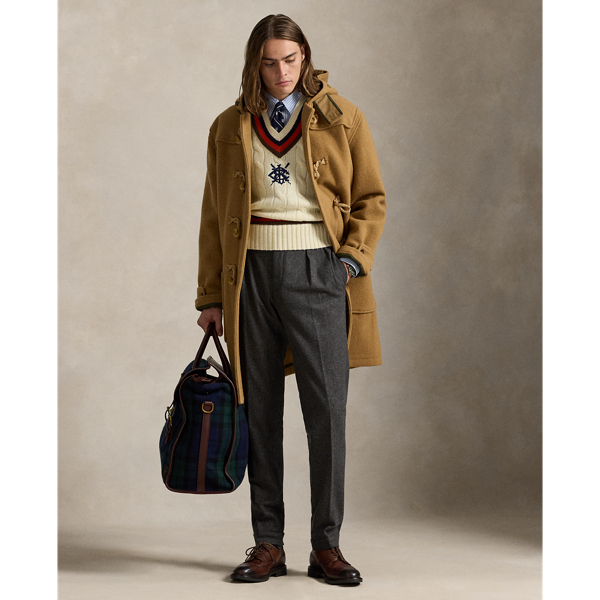 This reinterpretation of the classic toggle-front coat is made from wool herringbone cloth and filled with down-alternative insulation. As with vintage toggle coats, the hood features several snaps for a customisable fit.