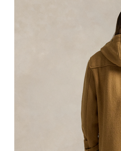 This reinterpretation of the classic toggle-front coat is made from wool herringbone cloth and filled with down-alternative insulation. As with vintage toggle coats, the hood features several snaps for a customisable fit.