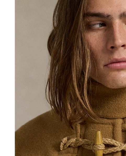 This reinterpretation of the classic toggle-front coat is made from wool herringbone cloth and filled with down-alternative insulation. As with vintage toggle coats, the hood features several snaps for a customisable fit.