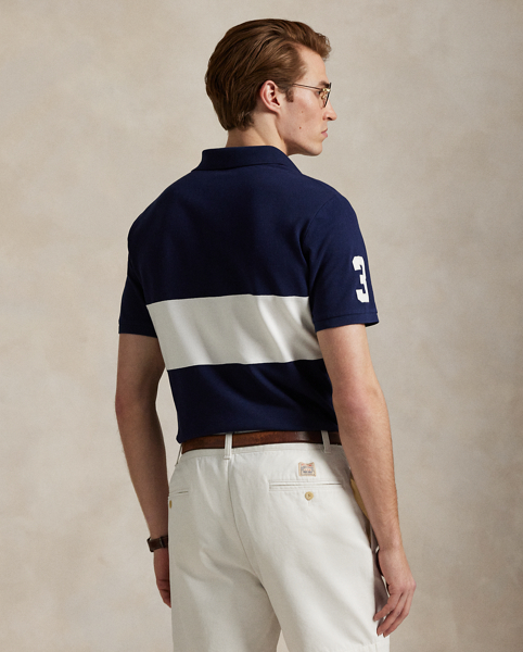 An American style standard since 1972, the Polo shirt has been imitated but never matched. Over the decades, Ralph Lauren Lauren has re-imagined his signature style in a wide array of colours and fits, yet all retain the quality and attention to detail of the iconic original. This version is made from our highly breathable cotton mesh and features a twill “3” patch, which is the number typically worn by a polo team’s strongest player.