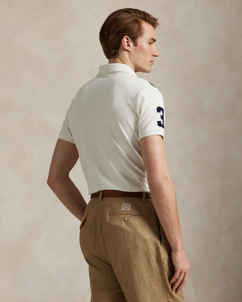 An American style standard since 1972, the Polo shirt has been imitated but never matched. Over the decades, Ralph Lauren Lauren has re-imagined his signature style in a wide array of colours and fits, yet all retain the quality and attention to detail of the iconic original. This version is made from our highly breathable cotton mesh and features a twill “3” patch, which is the number typically worn by a polo team’s strongest player.