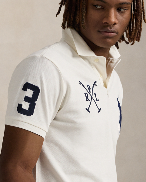 An American style standard since 1972, the Polo shirt has been imitated but never matched. Over the decades, Ralph Lauren Lauren has re-imagined his signature style in a wide array of colours and fits, yet all retain the quality and attention to detail of the iconic original. This version is made from our highly breathable cotton mesh and features a twill “3” patch, which is the number typically worn by a polo team’s strongest player.
