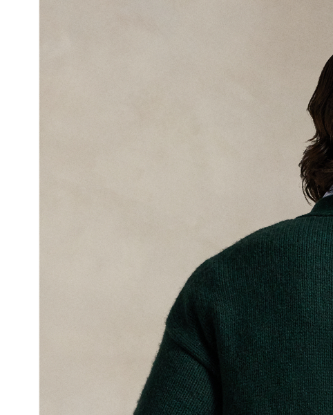 Part of the season's regatta-inspired collection, this cardigan is expertly knit with thick-gauge wool yarn from the United Kingdom and has an intarsia-knit "P" graphic on the chest.