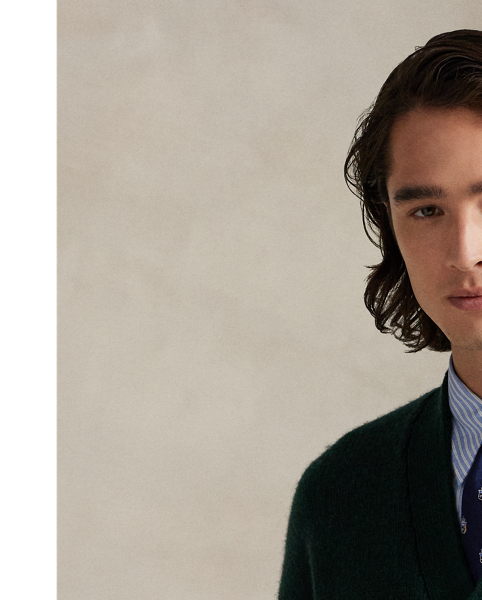 Part of the season's regatta-inspired collection, this cardigan is expertly knit with thick-gauge wool yarn from the United Kingdom and has an intarsia-knit "P" graphic on the chest.