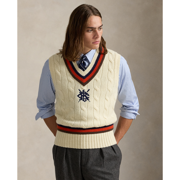 The cricket jumper is defined by its cable-knit pattern, usually in cream, as well as its V-neck and striped trim, which traditionally represents school or club colours. Part of the season's collection inspired by New England's storied regatta tradition, this version is embroidered with a signature crest and oars.