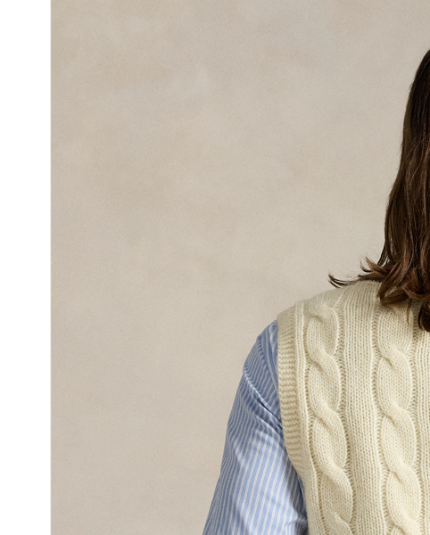 The cricket jumper is defined by its cable-knit pattern, usually in cream, as well as its V-neck and striped trim, which traditionally represents school or club colours. Part of the season's collection inspired by New England's storied regatta tradition, this version is embroidered with a signature crest and oars.