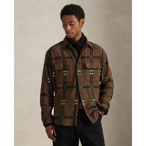Inspired by the vintage overshirts donned by woodsmen, this shirt contrasts a utilitarian silhouette and reinforced elbow patches with soft cotton flannel. A geometric jacquard design and corozo buttons add refined Polo style.