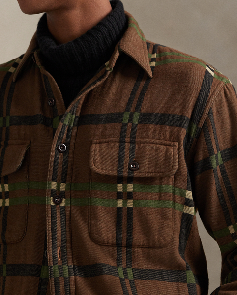 Inspired by the vintage overshirts donned by woodsmen, this shirt contrasts a utilitarian silhouette and reinforced elbow patches with soft cotton flannel. A geometric jacquard design and corozo buttons add refined Polo style.